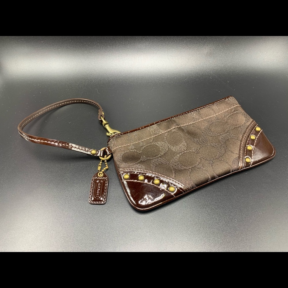Vintage Coach monogram wristlet w/studs, like new